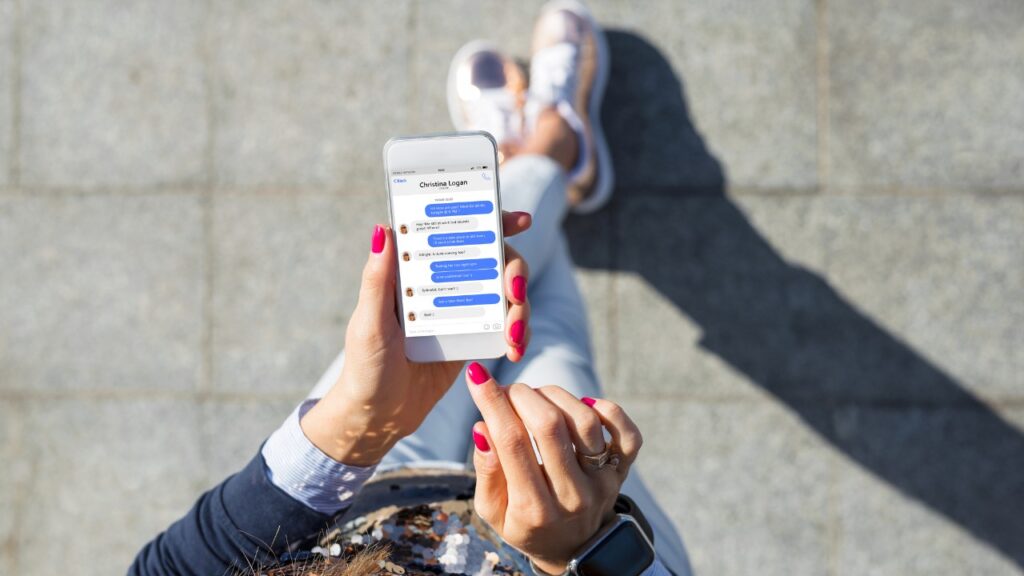 SMS messaging on smartphone demonstrating social media communication and digital connectivity.